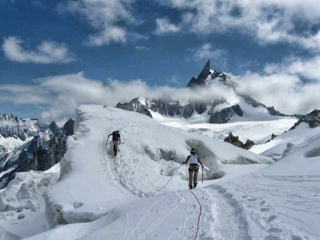 Negotiating the crevasses on the Glacier du Geant (Dent du Geant in background)