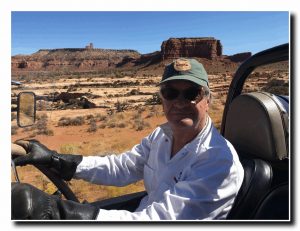 Steve Trafton driving ALF antique car on Utah highway.